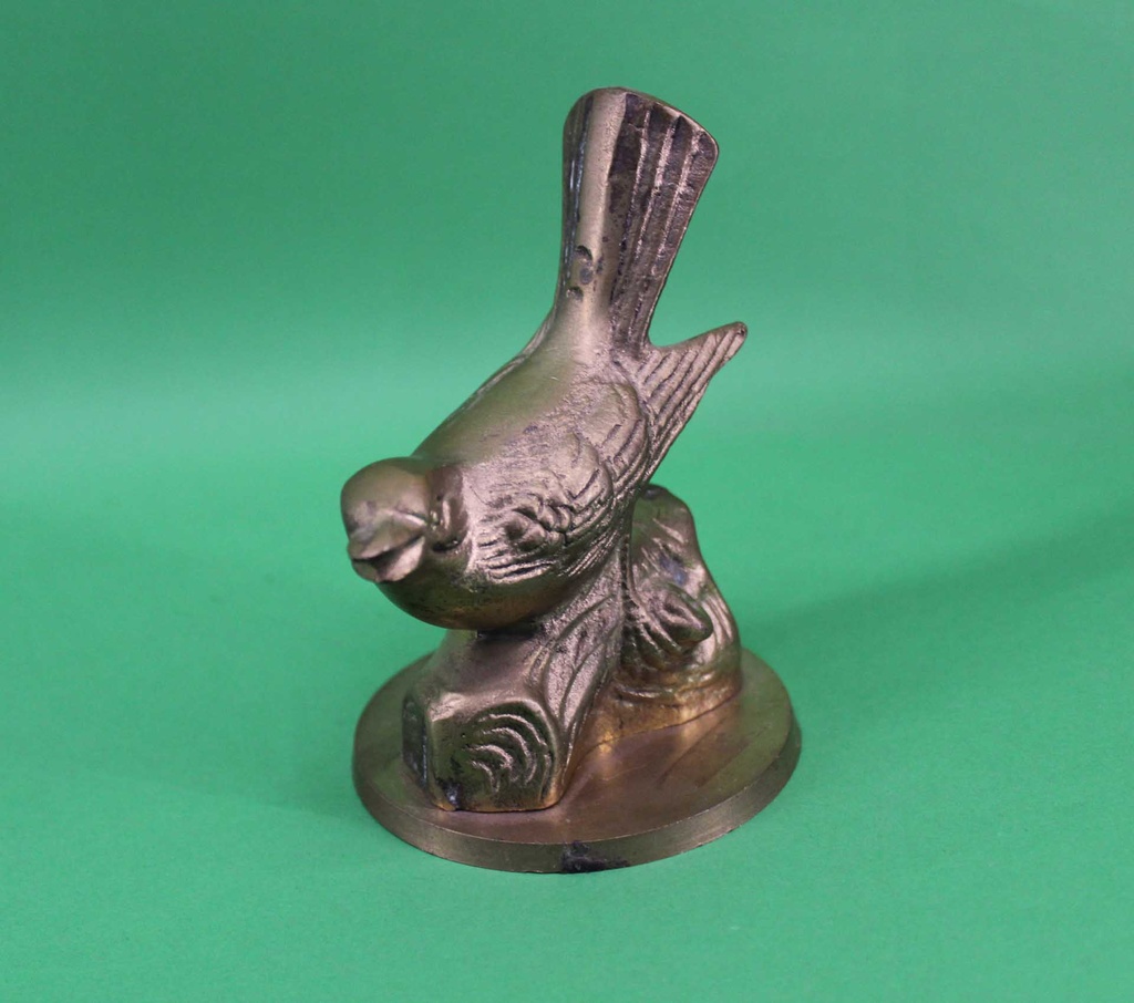 Brass Bird on Log